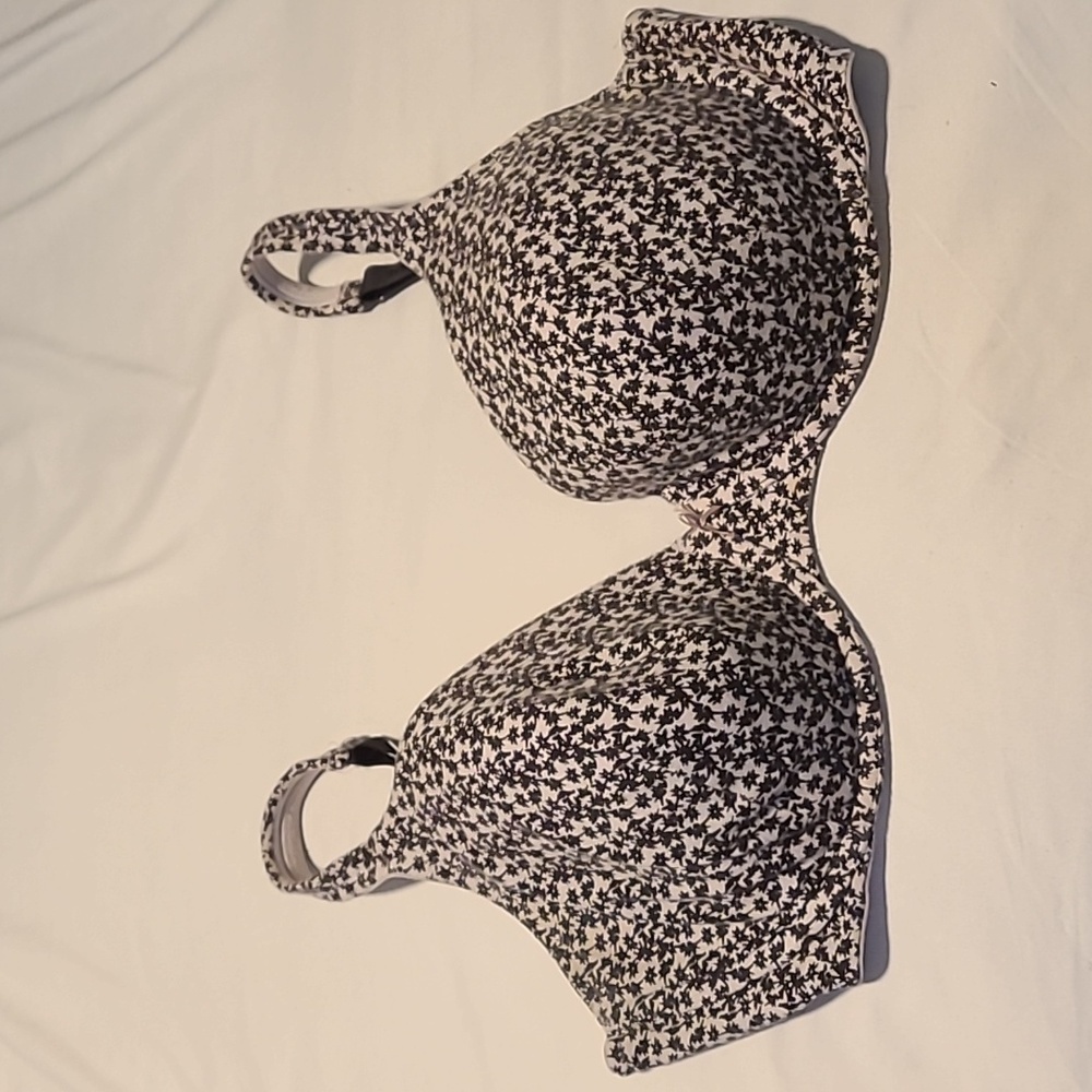 Off-white bra covered in black floral print
